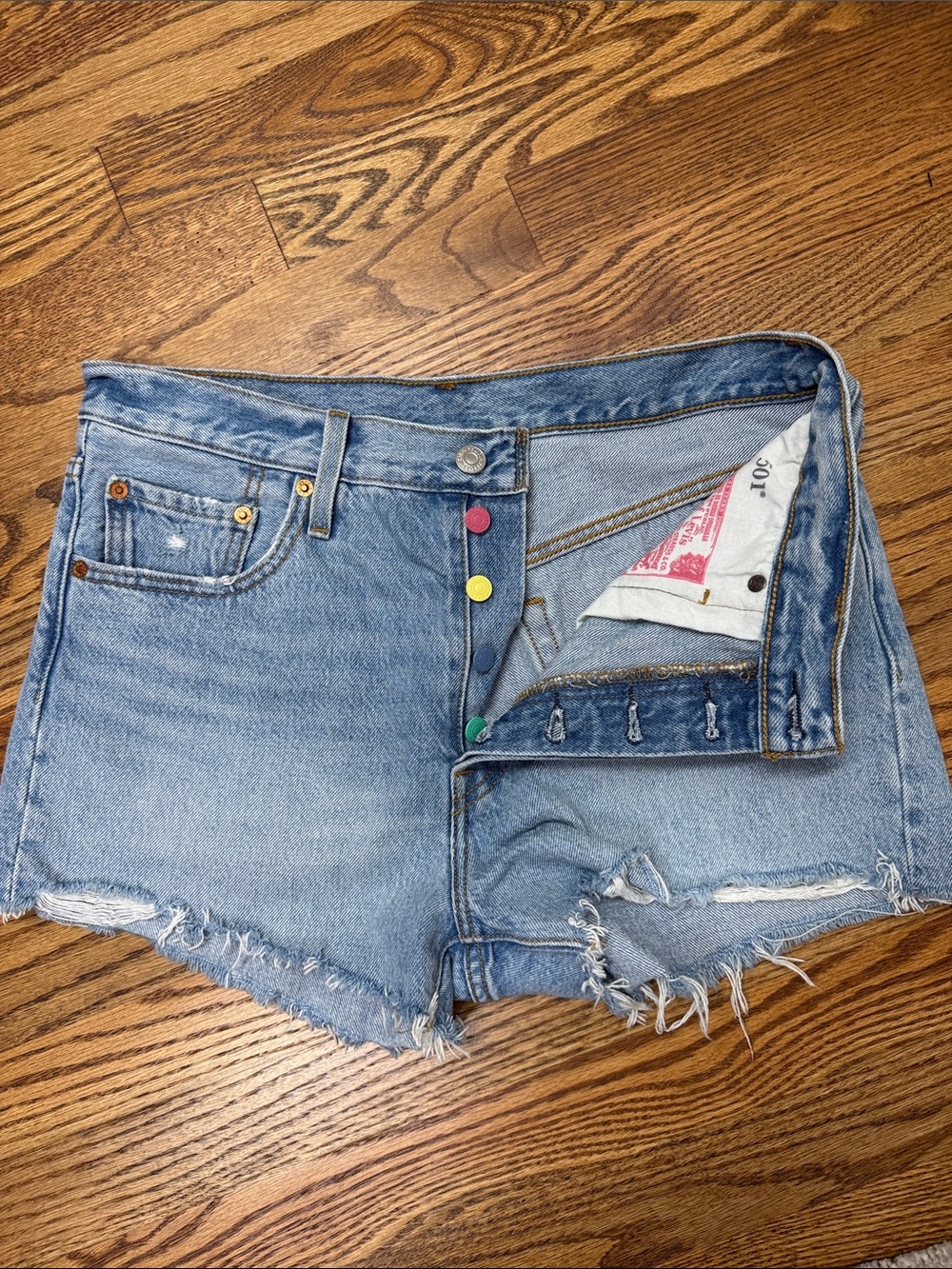Levi's Light Blue Denim Cutoff Shorts with Colorful Button Accents